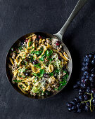 Fried Swabian egg noodles with leek and grapes