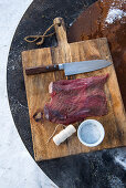 A winter barbecue: elk steak being prepared for a barbecue (Norway)