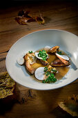 Natural cuisine: wild mushrooms in a clear broth