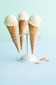 Vanilla ice cream in cones in a cone holder