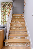 Staircase with white lacy patterns painted on risers