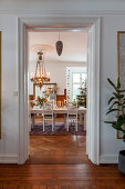 View through open door into festively decorated dining room