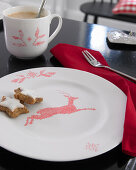 Crockery painted with red cross-stitch pattern