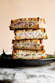 Indian yoghurt sandwiches, piled on a plate