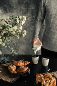 Man pouring milk on a glass