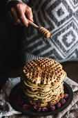 Waffels with raspberries on a dark background