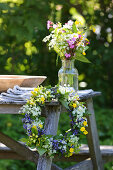 Vase of wildflowers and pretty wildflower wreath