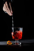 Negroni cocktail stirred with a bar stool