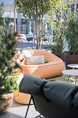 Various seating and potted plants in outdoor area