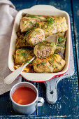 Cabbage leaves stuffed with meat and buckwheat, tomato sauce