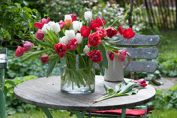Vase of tulips on terrace table