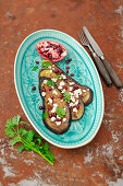Miso eggplant slices with feta and pomegranate
