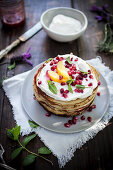 Pancakes with ricotta and pomegranate
