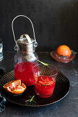 Homemade blood orangeade with rosemary