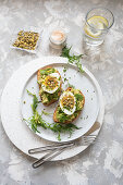 Sandwiches with avocado, egg and pistachio dukkah