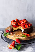 Mini cheesecake with fresh strawberries, sliced