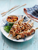 Hawker stall style chicken kebab with a satay dip (China)