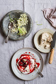 Greek yogurt with baked strawberries, halva and elderflowers