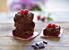 Vegan raspberry brownies with chocolate sprinkles and raspberries
