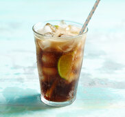 Cuba Libre with lime, rum, coca cola and ice cubes
