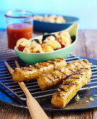 Marinated, grilled tofu sausages with a pasta salad