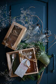 Jar of honey with tag in wooden box as Christmas present