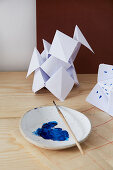 Paper ornaments with blue paint