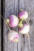 White turnips on a wooden surface