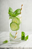 Refreshing basil cucumber cooler in a tall glass