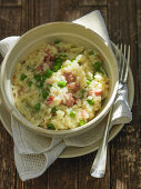 Beer risotto with bacon and peas