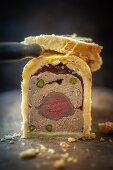 Game meatloaf with fillet meat and pistachios, sliced