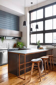 Masculine kitchen with industrial window and kitchen counter