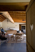 View into rustic dining room with wooden furniture