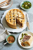 Game pie with cranberries and chestnuts