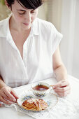 Young woman having tea