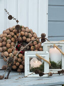 Wreath of walnuts and candle lanterns