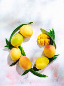 A circle of mangoes with leaves