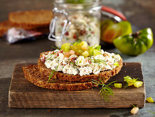 Wholemeal bread with feta, olive and tomato cream and green tomatoes
