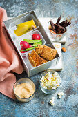 Lunch box with crackers and dips