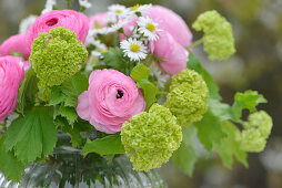 Spring bouquet with ranunculus and English Lawn Daisies