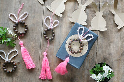 Easter bunnies made from beads with tassels and garland of paper bunnies