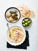 Artichoke Baba Ganoush with naan, falafel and stuffed vine leaves