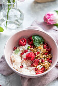 Rice flakes with granola, mint and raspberries
