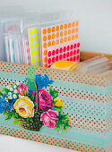 Box with stickers covered with washi tape and poetic pictures