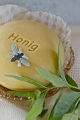 Honey soap with a paper bee and verbena branch