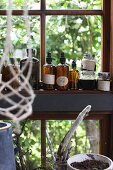 Glass jars in front of a window