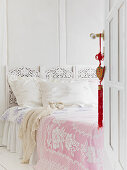 Open coffered door to bedroom with romantic bed