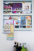 Wall-mounted book rack with cookbooks