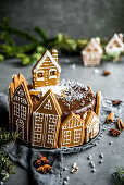 Christmas chocolate cheesecake decorated with gingerbread cottages