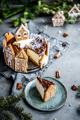 Christmas chocolate cheesecake decorated with gingerbread cottages